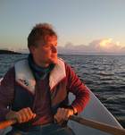 Kalle Ristikartano rowing a boat at sunset Kalle Ristikartano rowing a boat at sunset